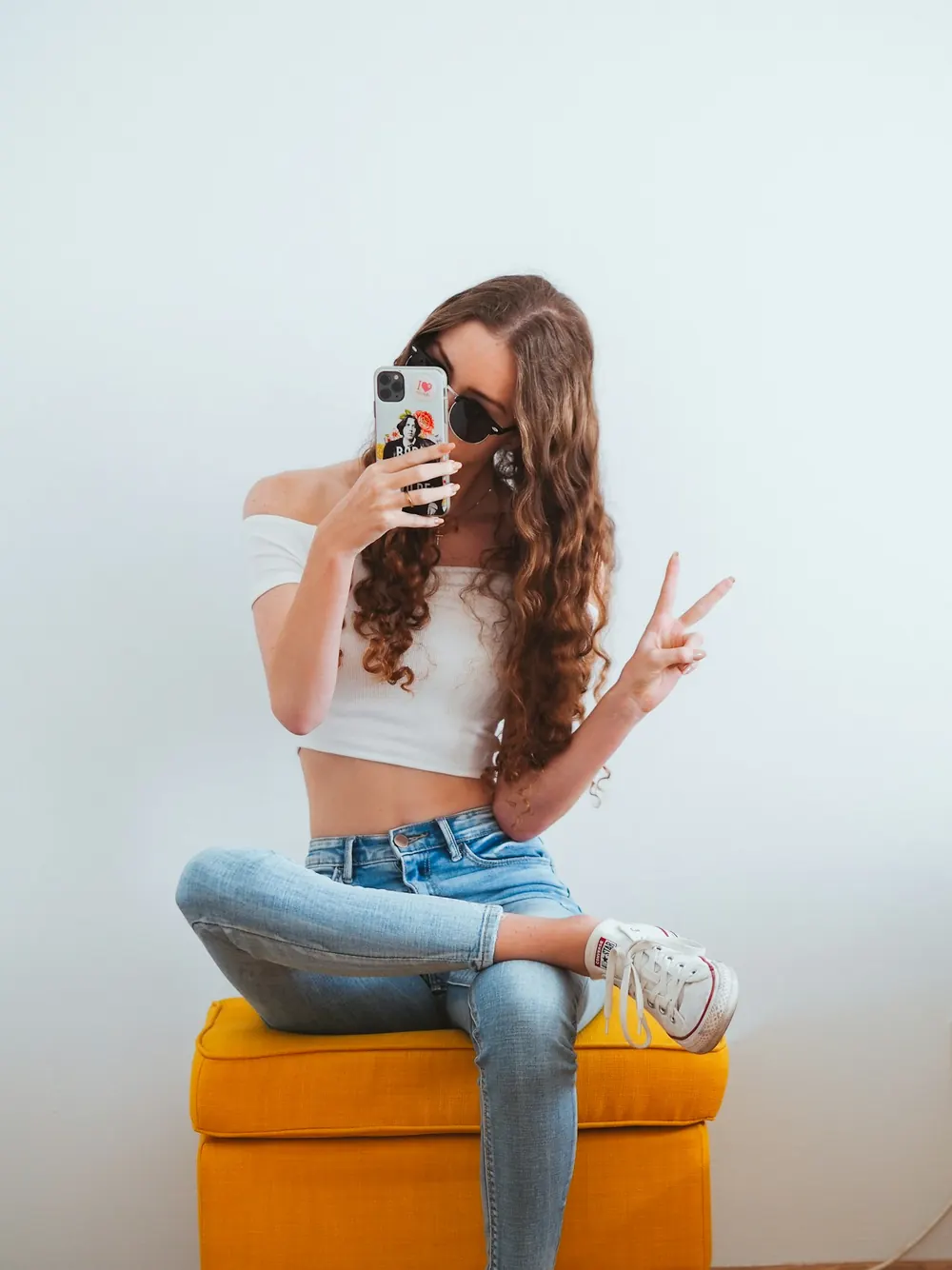A young creator taking a photo with a phone